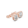 Rose gold earrings with clear gemstones on a white background