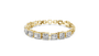 Gold bracelet with square-cut diamonds on a white background