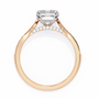 ring features a magnificent Emerald-cut diamond held in a refined prong setting
