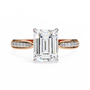 ring features a magnificent Emerald-cut diamond held in a refined prong setting