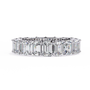"tennis ring" features a continuous circle of magnificent Emerald-cut diamonds set vertically