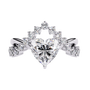ring features a magnificent Heart-shaped diamond set atop a sophisticated dual-band V-shape architecture