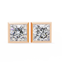 Pair of diamond stud earrings with rose gold prongs on a white background