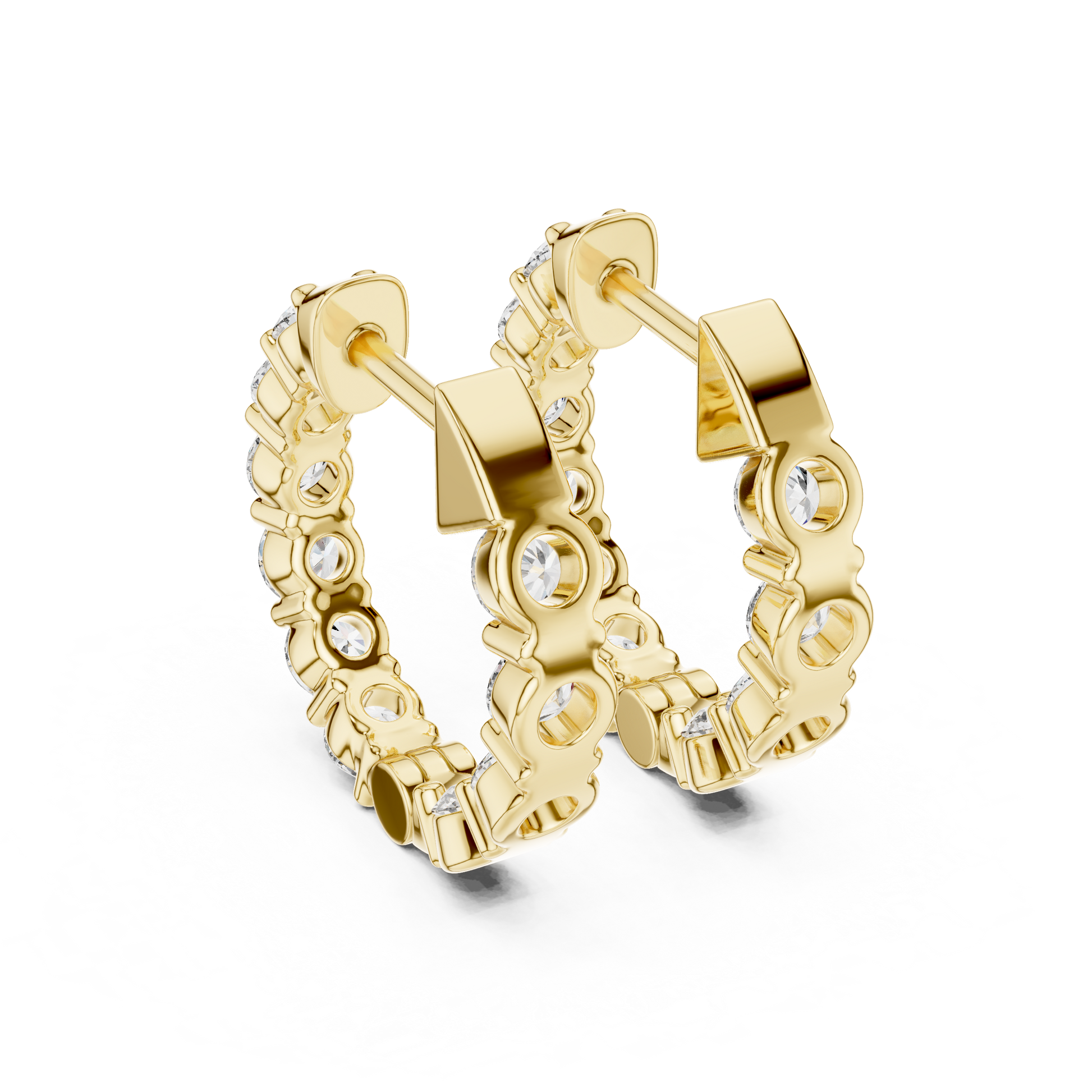 Gold hoop earrings with diamonds on a white background