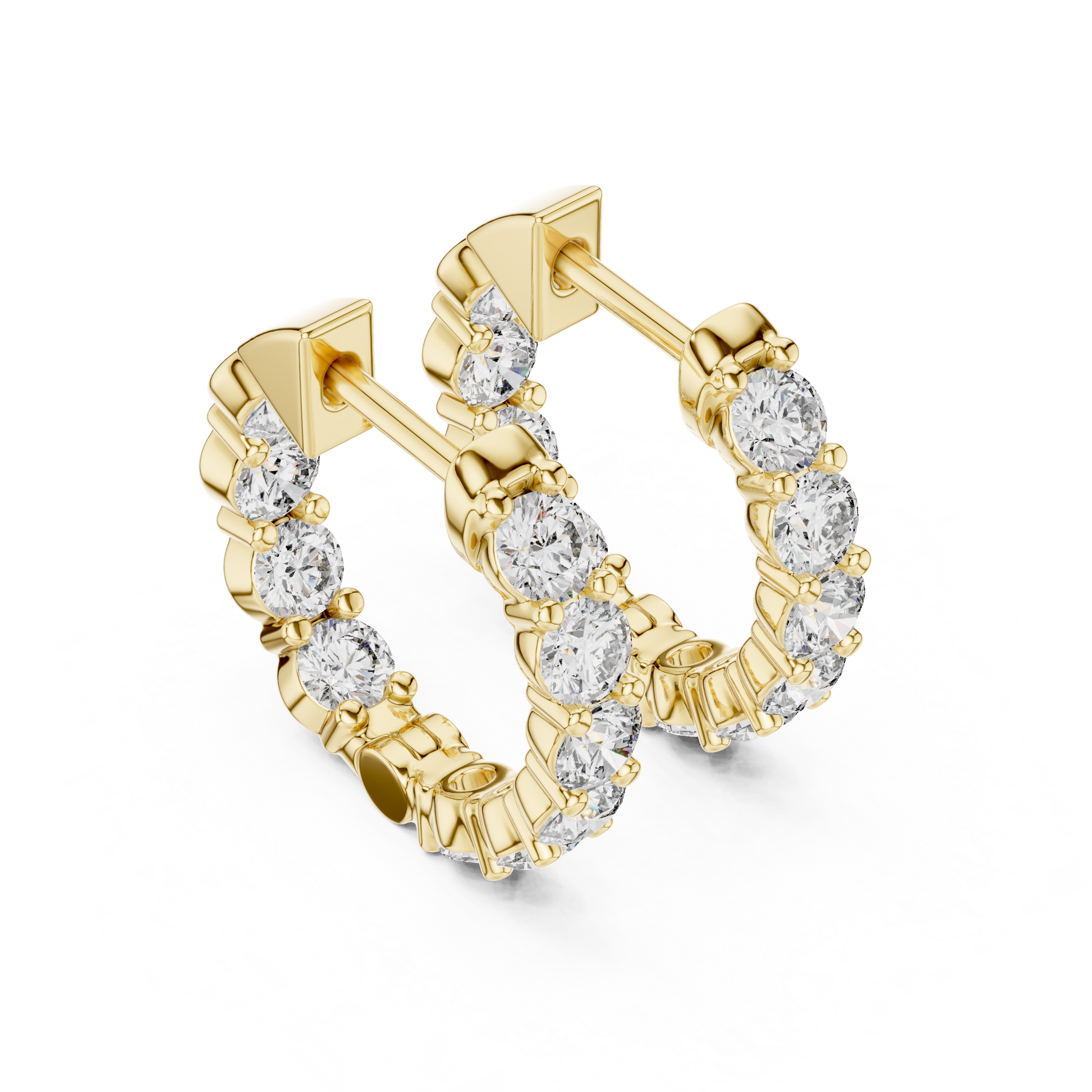 Gold hoop earrings with diamond accents on a white background