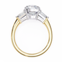 trilogy ring features a magnificent Cushion-cut solitaire flanked by two tapering baguette diamonds