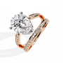 ring features a commanding Pear solitaire framed by two distinct architectural bands one linear and one curved both encrusted with Pavé diamonds