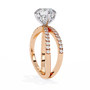 ring features a Round Brilliant solitaire supported by a sophisticated double band encrusted with Pavé diamonds
