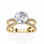 ring features a Round Brilliant solitaire supported by a sophisticated double band encrusted with Pavé diamonds