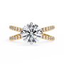 ring features a Round Brilliant solitaire supported by a sophisticated double band encrusted with Pavé diamonds