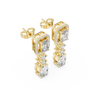Gold earrings with diamonds on a white background