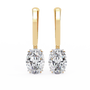 Gold earrings with diamonds on a white background