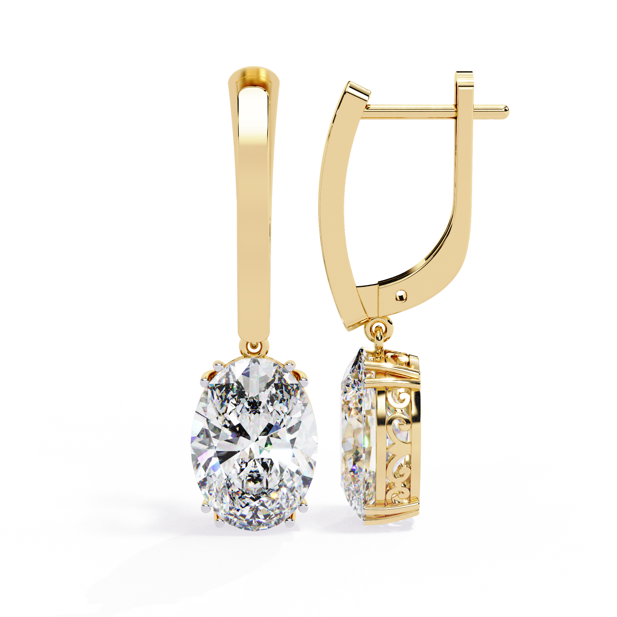 Gold earrings with a large diamond and smaller gemstone on a white background