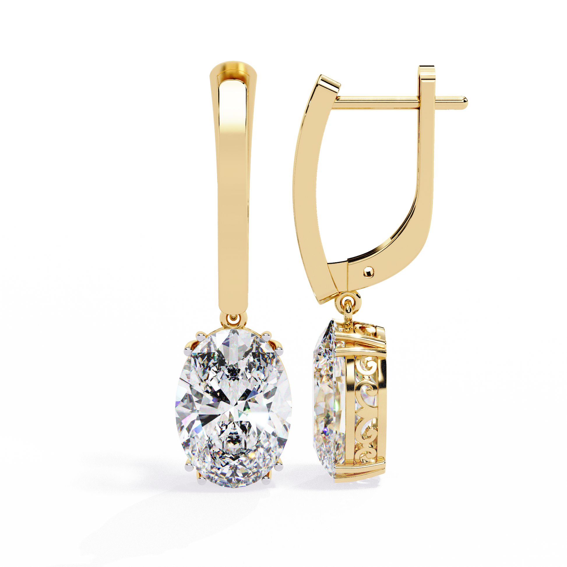 Gold earrings with a large diamond and smaller gemstone on a white background
