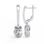 Silver earrings with diamonds on a white background