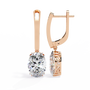 Rose Gold earrings with diamonds on a white background