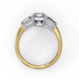 ring features a magnificent Emerald-cut centre flanked by two tapering baguette diamonds