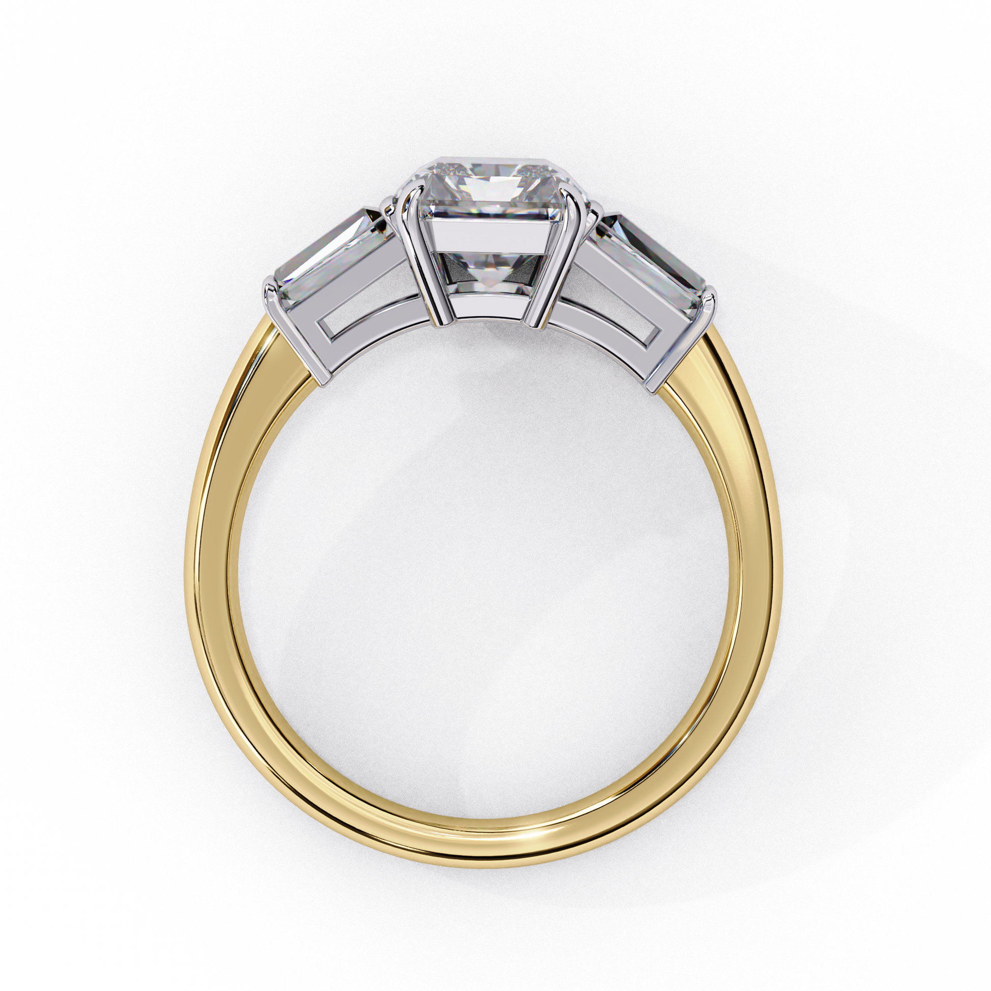 ring features a magnificent Emerald-cut centre flanked by two tapering baguette diamonds