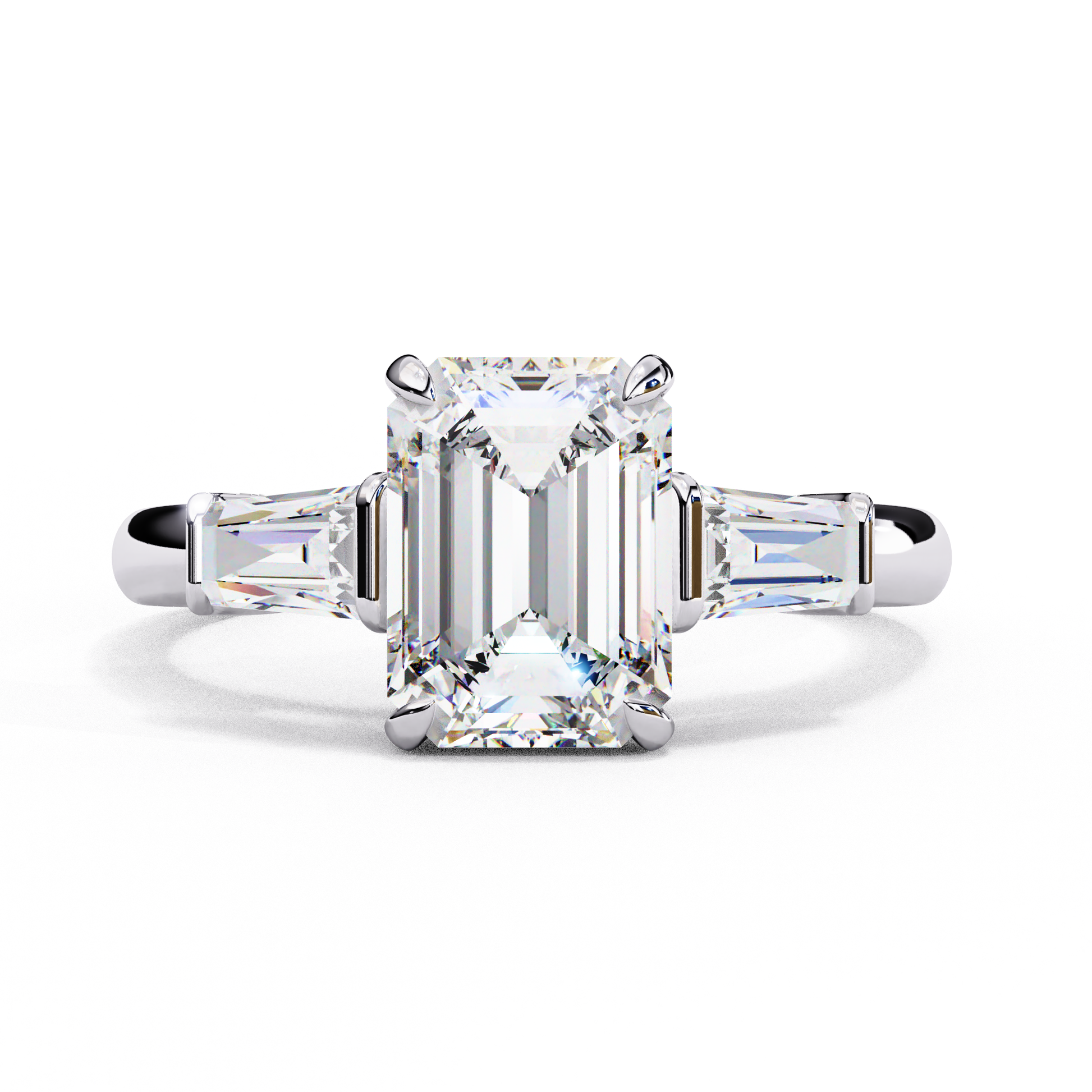 ring features a magnificent Emerald-cut centre flanked by two tapering baguette diamonds