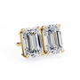 Gold earring with emerald-cut diamonds on a white background