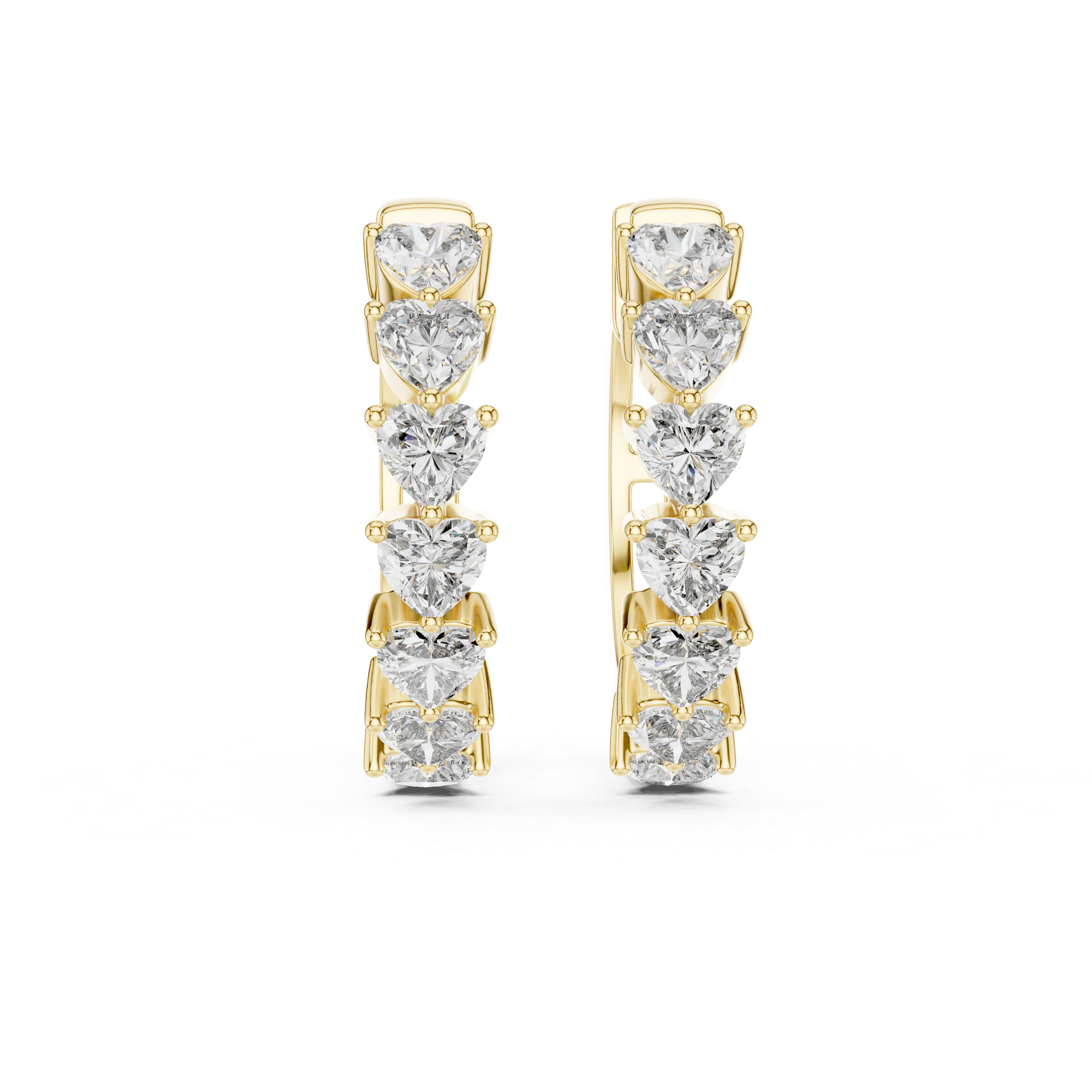 Pair of gold hoop earrings with heart-shaped diamonds on a white background
