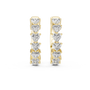 Pair of gold hoop earrings with heart-shaped diamonds on a white background