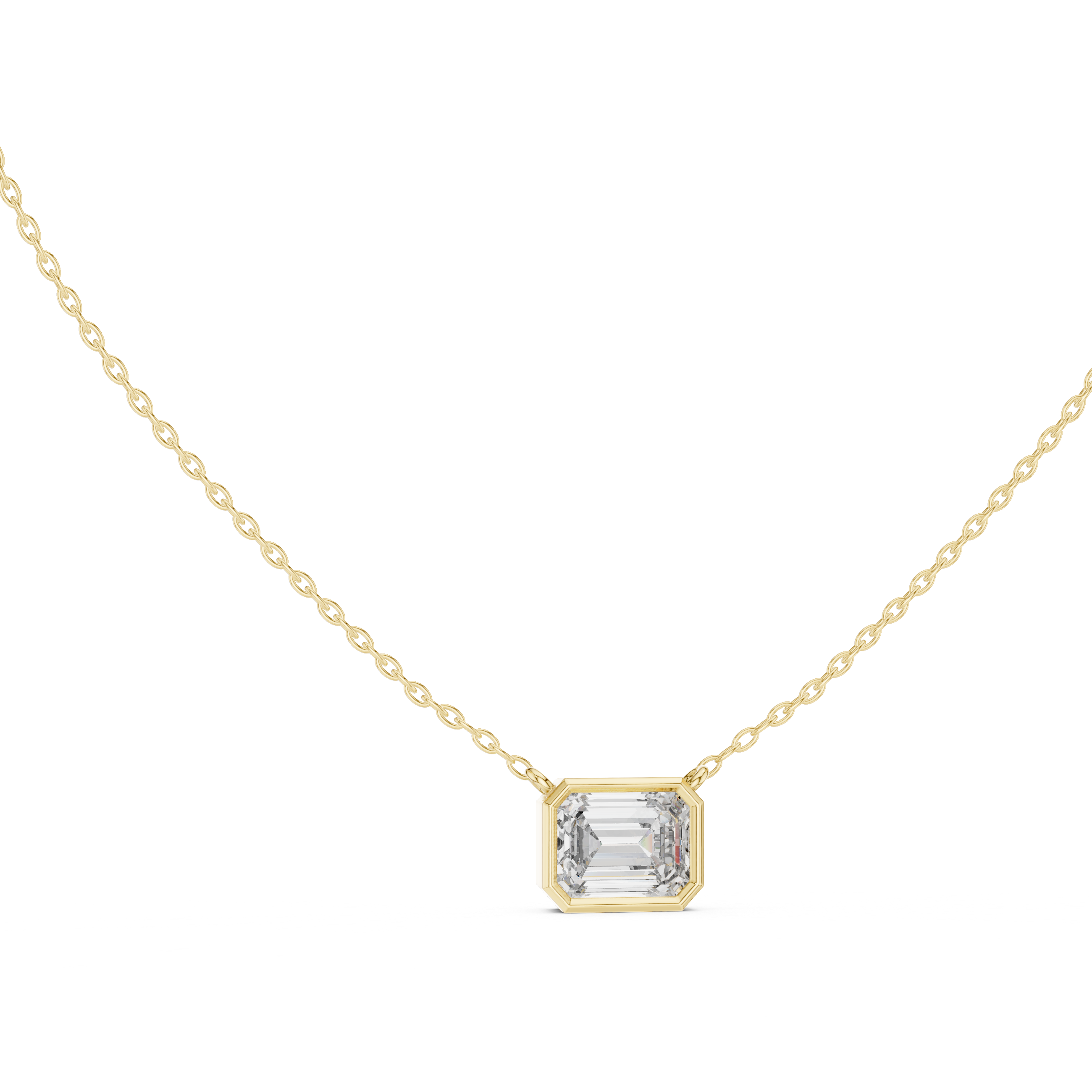 Gold necklace with a emerald pendant on a white background