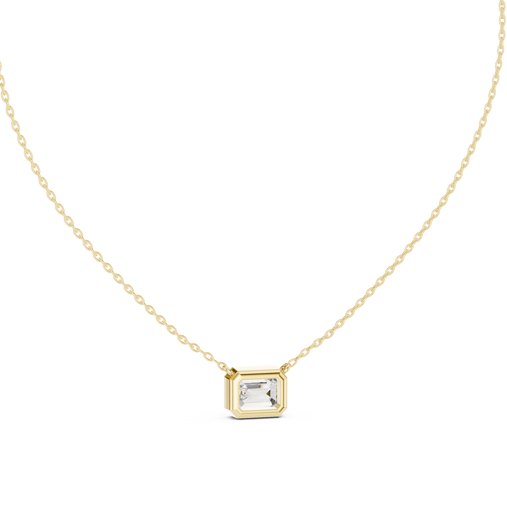 Gold necklace with a emerald pendant on a white background
