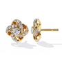 Gold earrings with diamond accents on a white background