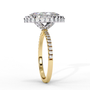 ring features a brilliant Marquise-cut solitaire encircled by a seamless halo of shimmering diamonds