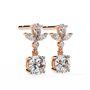 Pair of diamond earrings with gold accents on a white background
