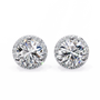 Pair of round diamond stud earrings on a white background