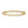 Gold and silver bracelet with diamonds on a white background