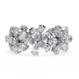 full eternity band features Pear and Round diamonds meticulously arranged into a continuous sequence of shimmering flowers