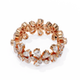 full eternity band features Pear and Round diamonds meticulously arranged into a continuous sequence of shimmering flowers
