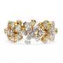 full eternity band features Pear and Round diamonds meticulously arranged into a continuous sequence of shimmering flowers