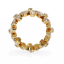 full eternity band features Pear and Round diamonds meticulously arranged into a continuous sequence of shimmering flowers