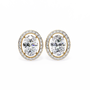 Pair of gold earrings with oval diamonds on a white background