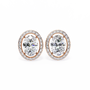 Pair of diamond earrings with rose gold setting on a white background