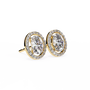 Pair of gold earrings with oval diamonds on a white background