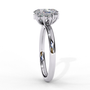 ring features an Oval Diamond centre flanked by a delicate cluster of shimmering round diamonds on either side