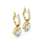 Gold earrings with diamonds on a white background