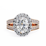 ring showcases a spectacular Oval Diamond encircled by a shimmering halo