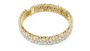 Gold bracelet with diamond accents on a white background