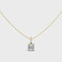 Gold pendant necklace with a diamond on a white background