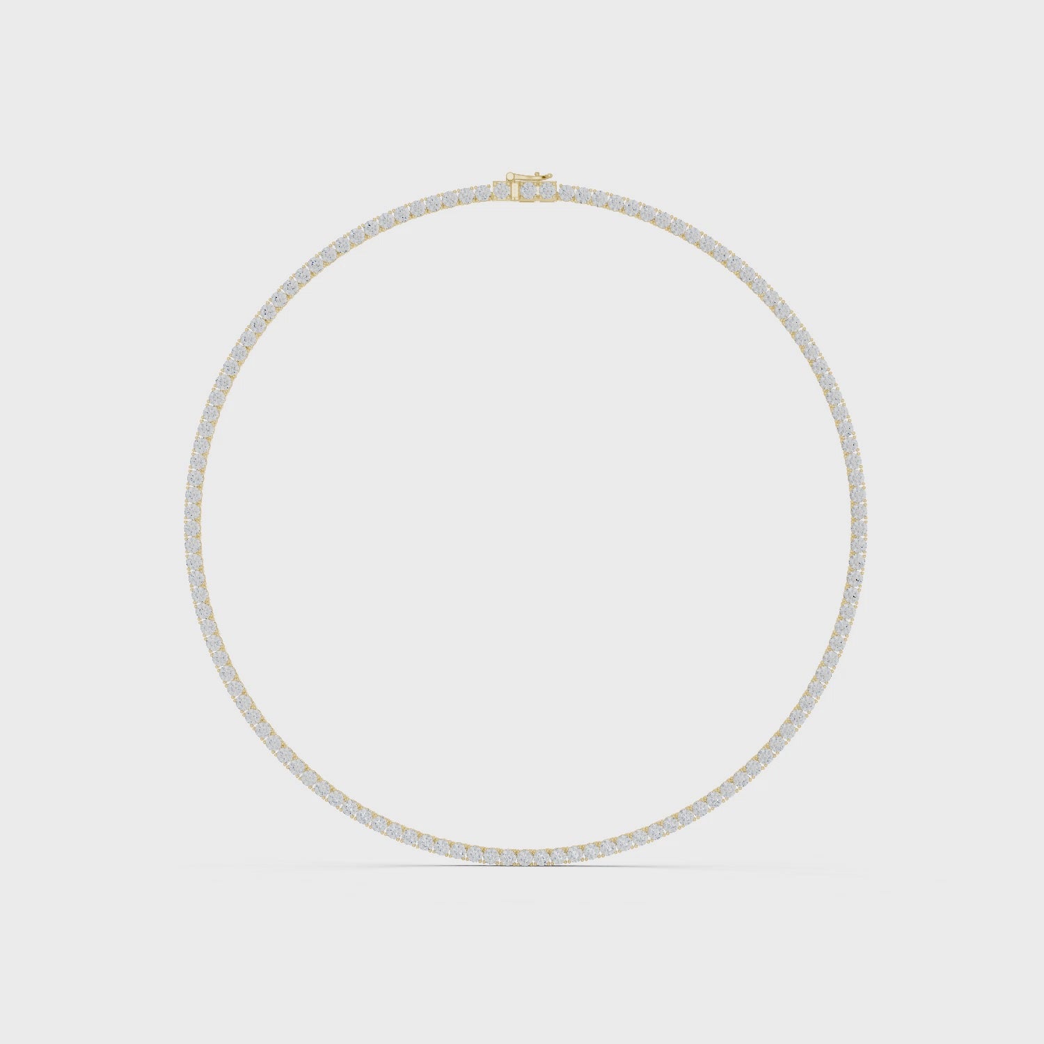 Gold necklace with small diamonds on a white background