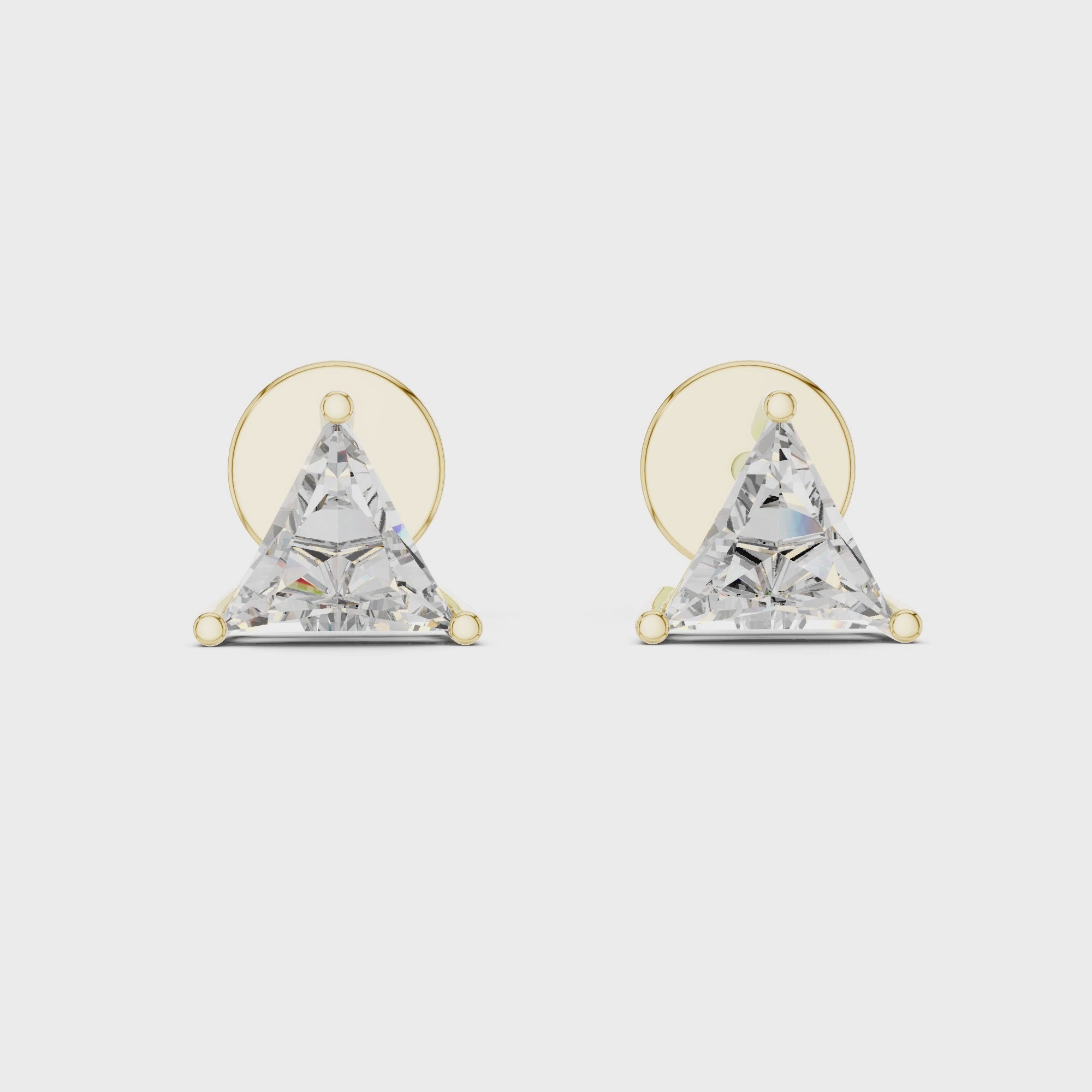 Pair of triangle-shaped diamond earrings with gold posts on a white background