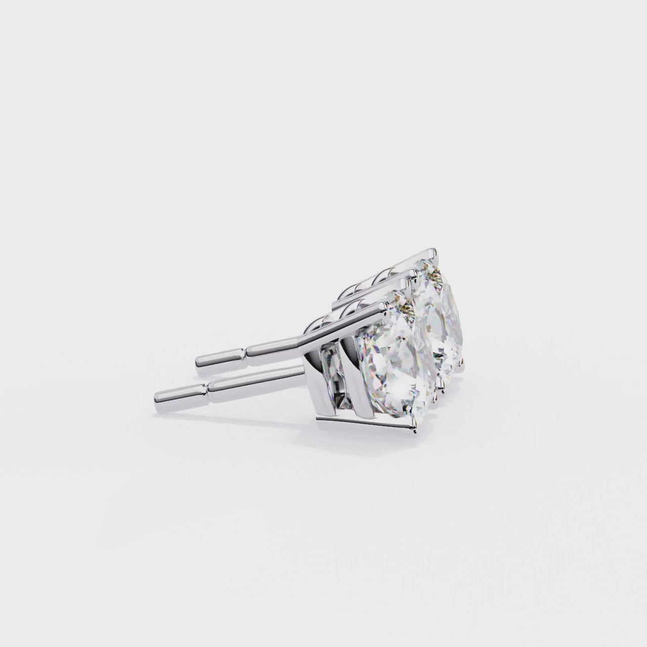 Pair of diamond stud earrings on a white background