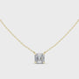 Gold necklace with a Asscher-cut diamond pendant on a white background