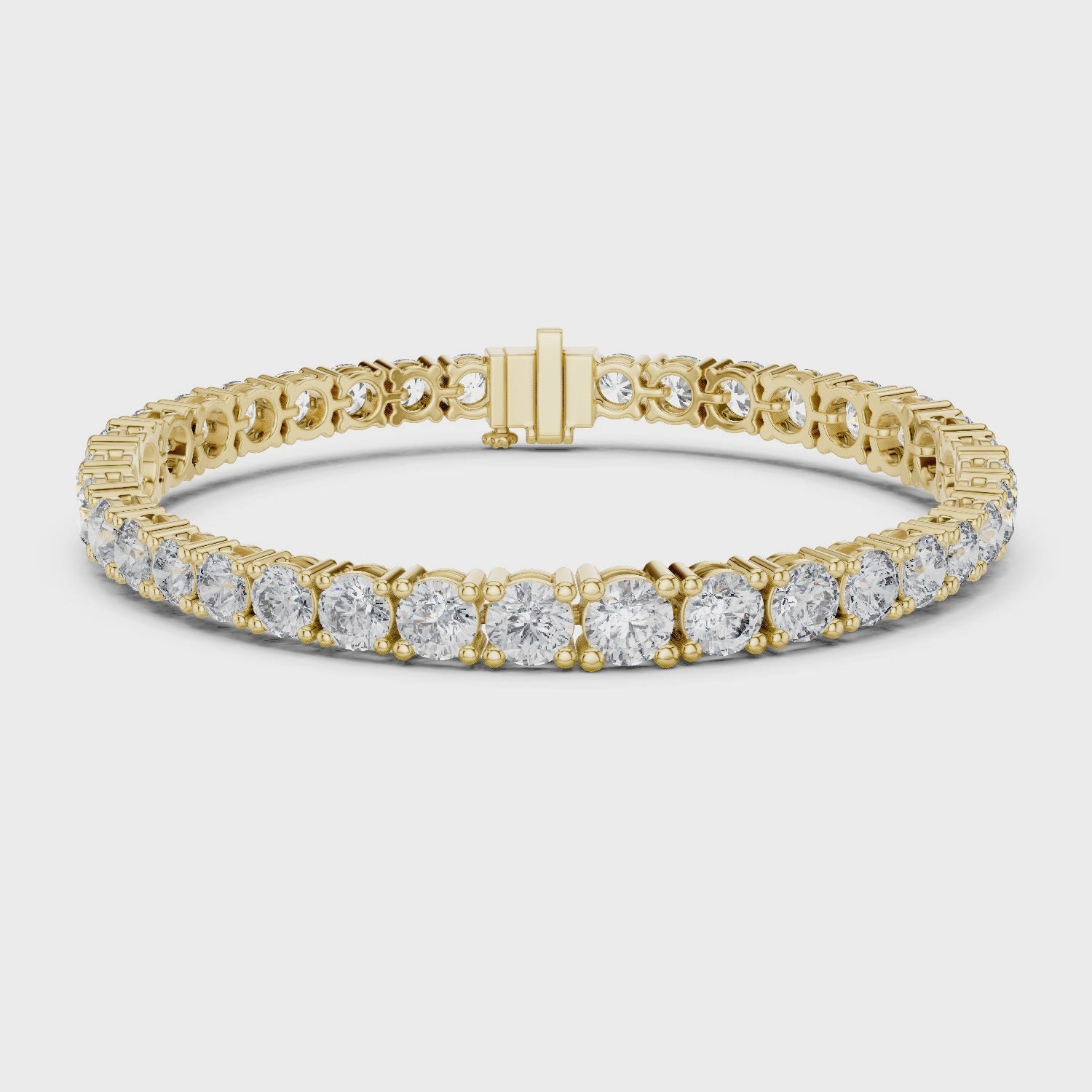 Gold bracelet with diamond accents on a white background